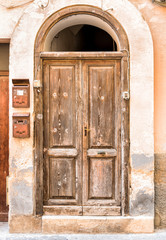 Old wooden door of the ancient house.