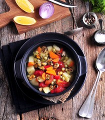Fish soup with wild mussels, potatoes, carrots, tomatoes, pepper and dill.