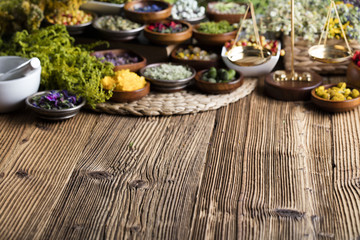 Assorted natural medical herbs and mortar