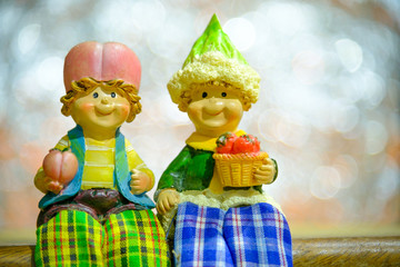 Baby doll with abstract circular bokeh background created by neon lights.