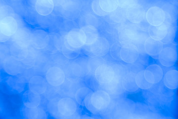 Blue bokeh background created by neon lights.