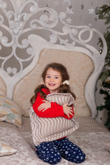 Sweet girl in pajamas getting ready for bed