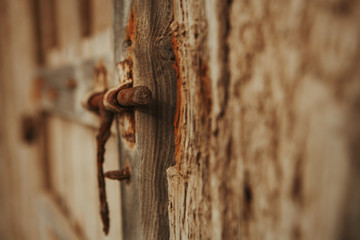Closed rusty on an wooden door