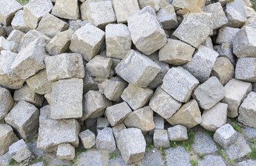 Pile of paving stone. Ready for construction. Outdoors.