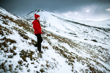 Shot of a young woman looking at the landscape while hiking in the mountains Lifestyle hiking concept