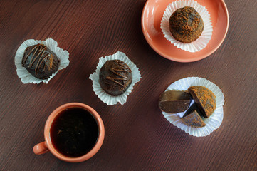 Cookies and coffee on a wooden table. Top view