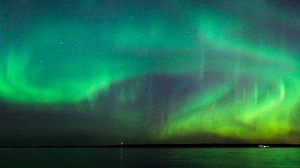 Northern lights over lake in finland
