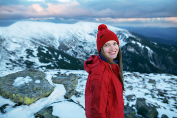 Portrait of a young woman hiking in the mountains