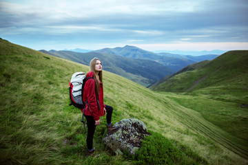 Shot of a young woman looking at the landscape while hiking in the mountains - 128211340