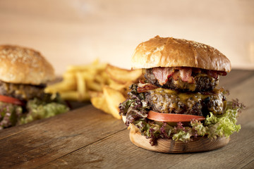 Fresh home-made hamburger served on wood, place for typography