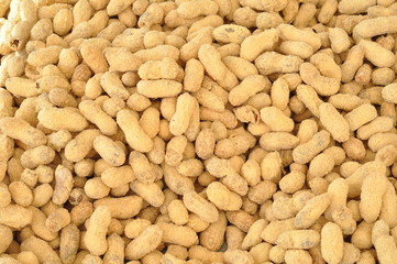 Raw peanuts at a farmer's market, texture background top view