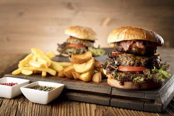 Fresh home-made hamburger served on wood, place for typography