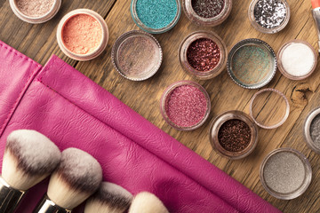 Make up artist theme. Various makeup products. Top view. Set of professional cosmetic: make-up brushes, shadows, lipstick. Place for typography and logo.