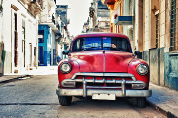 Vintage classic american car parked in a street of Old Havana, Cuba