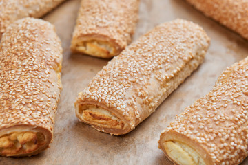 Homemade appetizers with cheese fillings. Cakes sprinkled with s