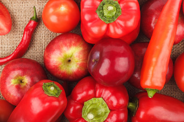 Set of red vegetables and fruits on the burlap