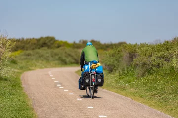 Deurstickers Cyclist on a bike path in the dunes Noordwijk © misign