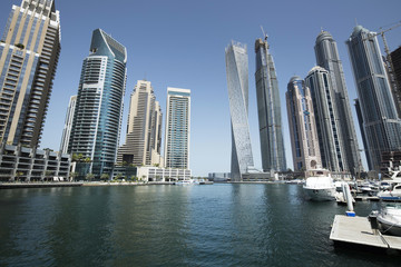 Architecture theme. Dubai, marina bay at noon. Luxurious travel and living.. Business and finance concept. Futuristic architecture. Luxury apartments. High value properties.