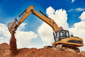 Loader excavator at sandpit during earthmoving works © Kadmy