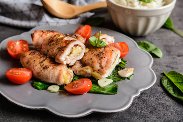 Roasted turkey breasts stuffed with Camembert, served with rice