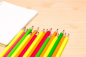 office desk group of pencil and book on wooden desk,