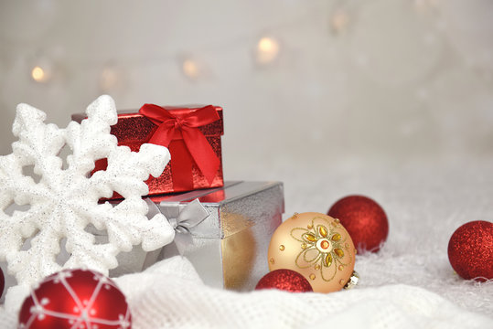 Christmas balls, gifts and snowflake on abstract background