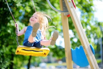 Cute little girl having fun on a playground