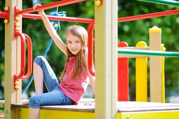 Cute little girl having fun on a playground