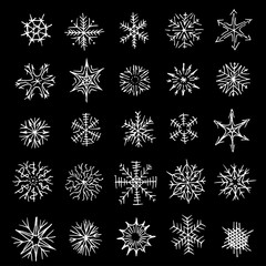 Many different shapes of snowflakes. Drawn by hand. Black and white illustration. icons