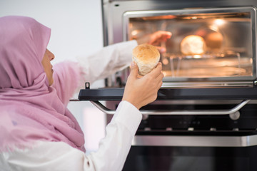 Arabic beautiful housewife making a lunch in kitchen