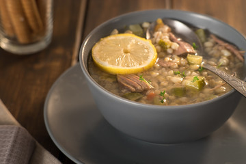Meat soup with lemon, wine and bread