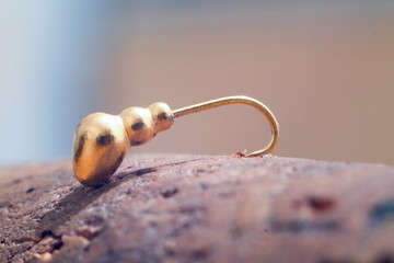 Jig for winter fishing on the table.