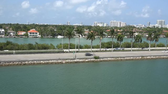 MIAMI,FLORIDA,USA-MAY 2015. Parallel view of highway I 95 from the sea side 4K timelapse