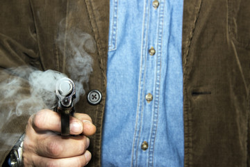 Obraz premium Man with a smoking gun