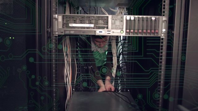 Man inside server rack install the equipment