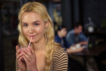 Woman drinking a milkshake