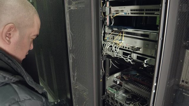 Support Workers Inspect the Server Rack