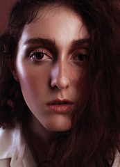 Portrait of a beautiful girl with freckles and light wear make up