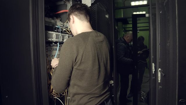 Workers a Data Center Connect Equipment