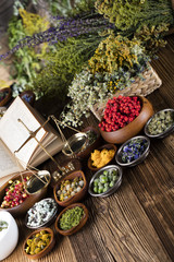 Assorted natural medical herbs and mortar
