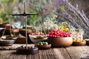 Assorted natural medical herbs and mortar