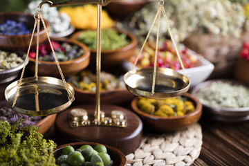 Assorted natural medical herbs and mortar