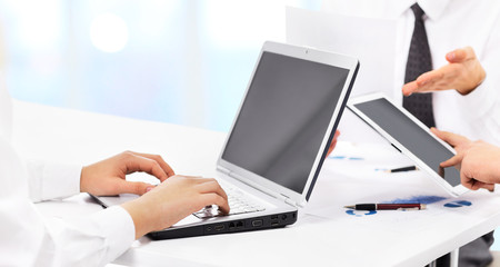 Close up of group of business people working at the office