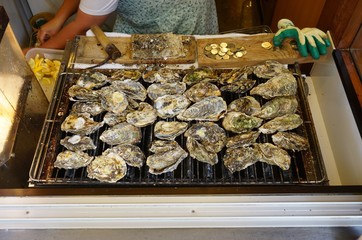 Grilled oysters, the food specialty of Miyajima, Japan
