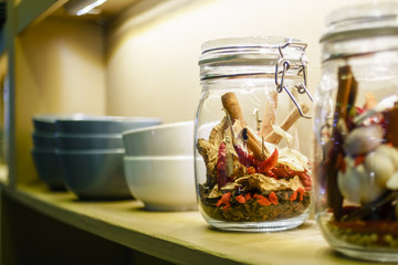Idea of interior home decoration with grains, herbs bottles