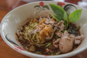 closeup Thai noodles with boiled in a bowl. ( Moo nam tok) at restaurant.