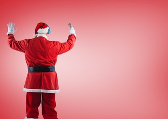 Santa claus standing against red background