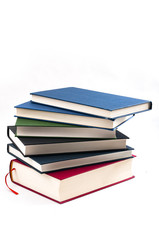 Personal improvement through education concept with a stack of books arranged to look like a staircase isolated on white