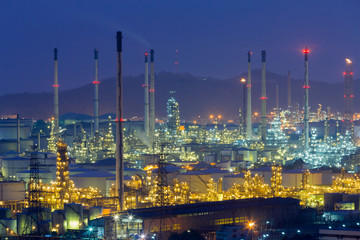 Obraz na płótnie Canvas Night light over Oil refinery aerial view with twilight sky background