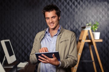 Creative businessman using tablet